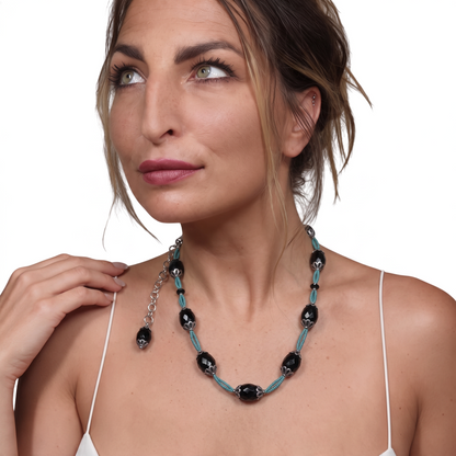 Trebor Style black agate and turquoise thread necklace with silver filigree accents worn by a woman