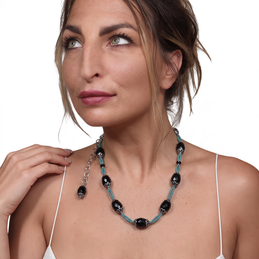 Trebor Style black agate and turquoise thread necklace with silver filigree accents worn by a woman