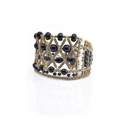 Trebor Style wide cuff bracelet featuring intricate black faceted beads and metallic gold lattice-work detailing.