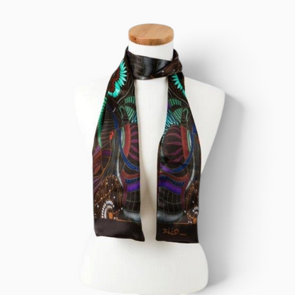 Trebor Style black silk satin tube scarf featuring a vibrant jungle print in blue, green, purple, and burgundy.