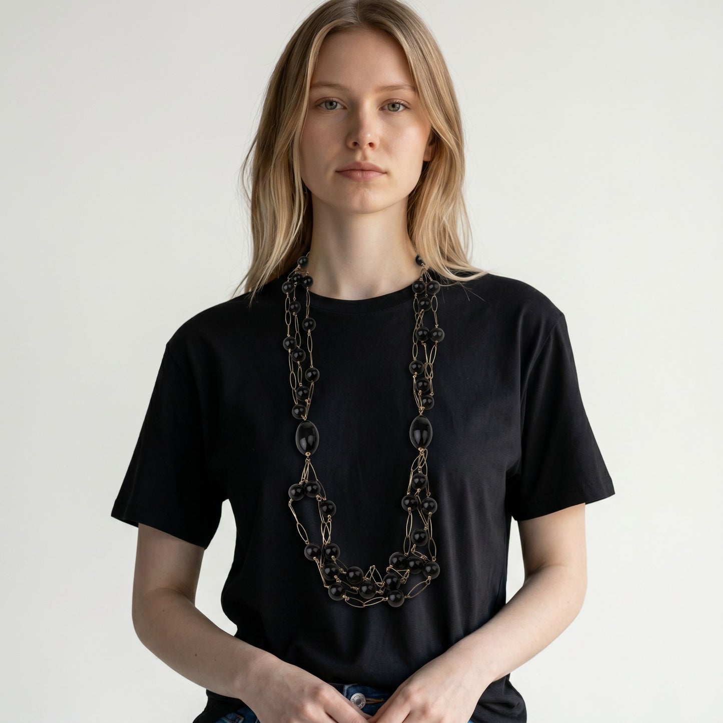 Trebor Style long triple strand necklace featuring black onyx beads and rose gold plated sterling silver open links.