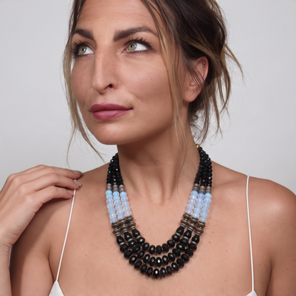 Trebor Style Masha Archer three-strand statement necklace with black onyx, opalite milkglass, and gold-plated beads.