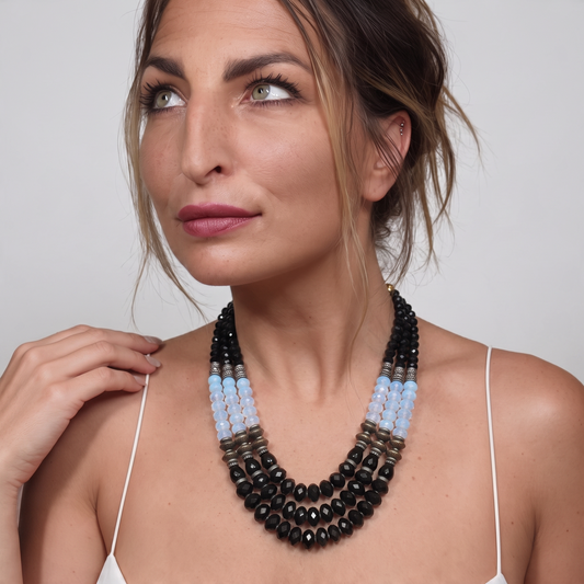 Trebor Style Masha Archer three-strand statement necklace with black onyx, opalite milkglass, and gold-plated beads.