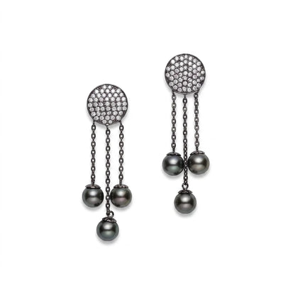 Black rhodium-plated silver drop earrings with cubic zirconia pavé and black Tahitian pearls by Dyanne Belle.