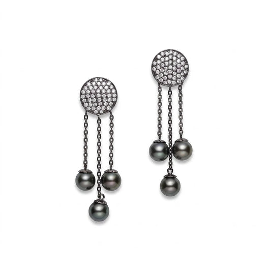 Black rhodium-plated silver drop earrings with cubic zirconia pavé and black Tahitian pearls by Dyanne Belle.