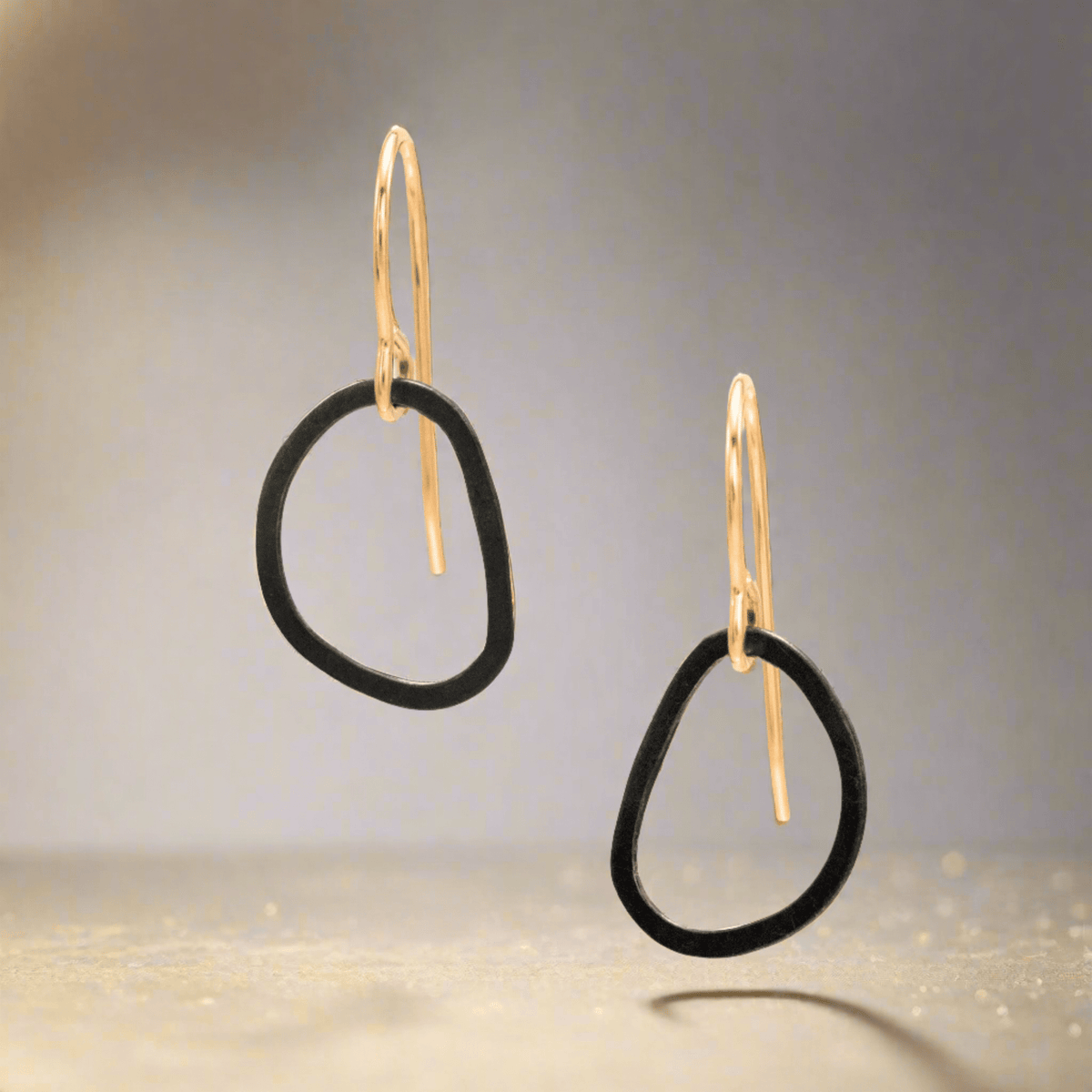 Trebor Style Noir drop earrings featuring open blackened sterling silver circles on 14kt gold-filled hooks.