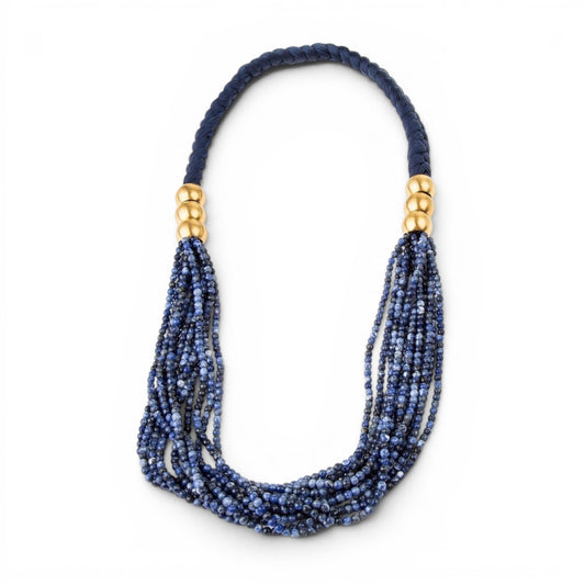 Trebor Style multi-strand blue sodalite gemstone necklace with navy braided silk cord and brushed gold plated accents.