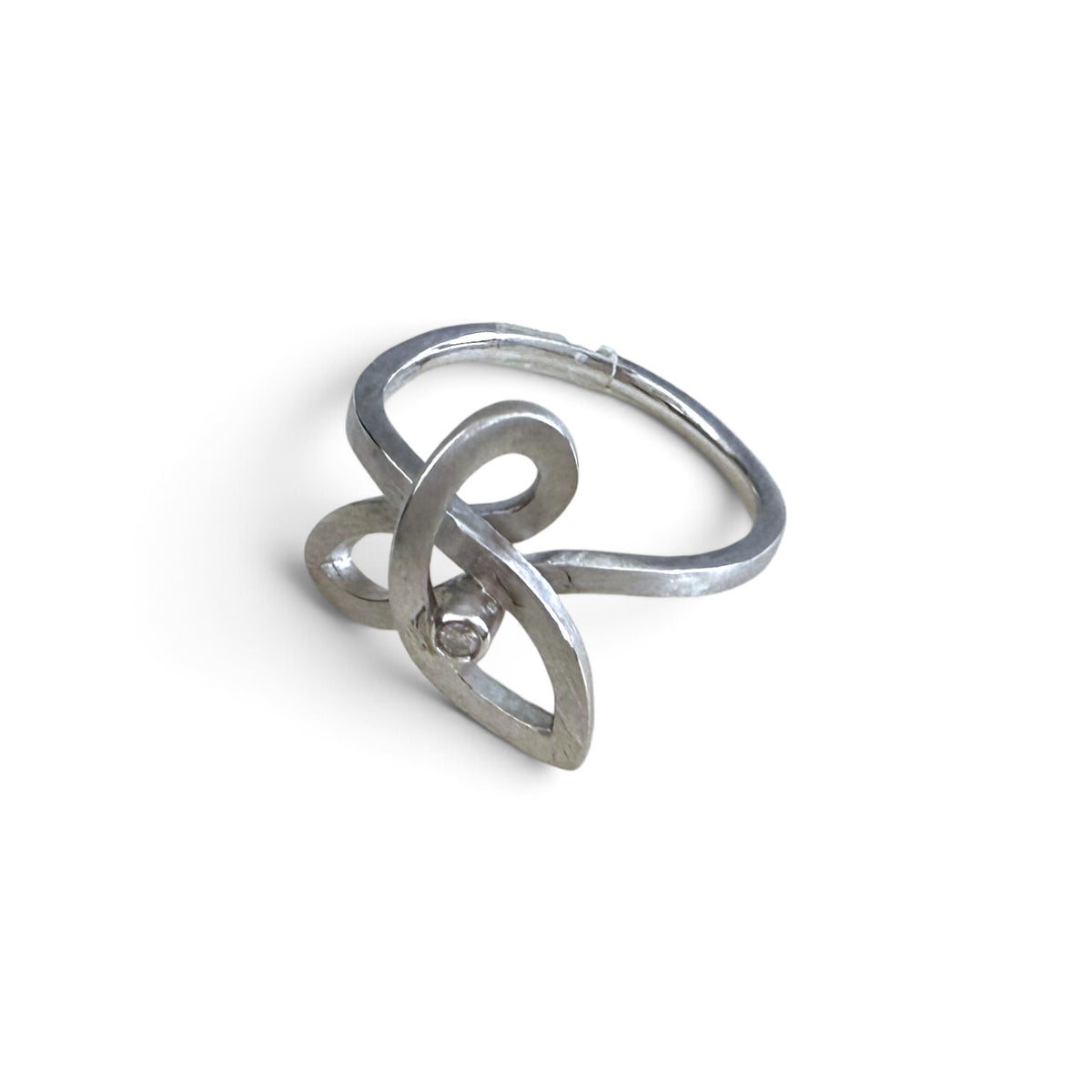 Trebor Style brushed sterling silver ring featuring a fluid weave design and a single diamond accent.