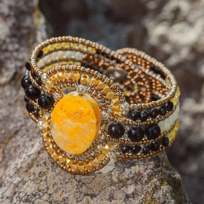 Trebor Style Arkanis oval Bumblebee Jasper cuff bracelet with agate, spinel, Murano glass, and freshwater pearls.