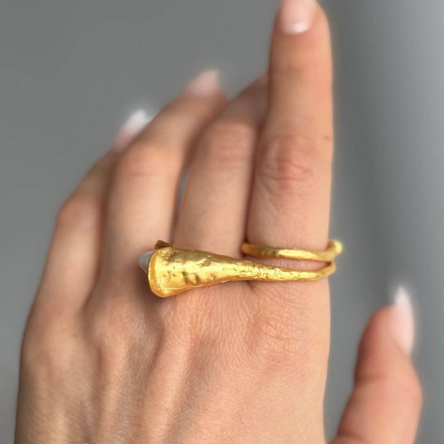 Trebor Style calla lily ring in brushed 24k gold filled metal with a lustrous biwa pearl worn on a finger