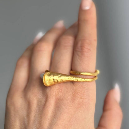 Trebor Style calla lily ring in brushed 24k gold filled metal with a lustrous biwa pearl worn on a finger