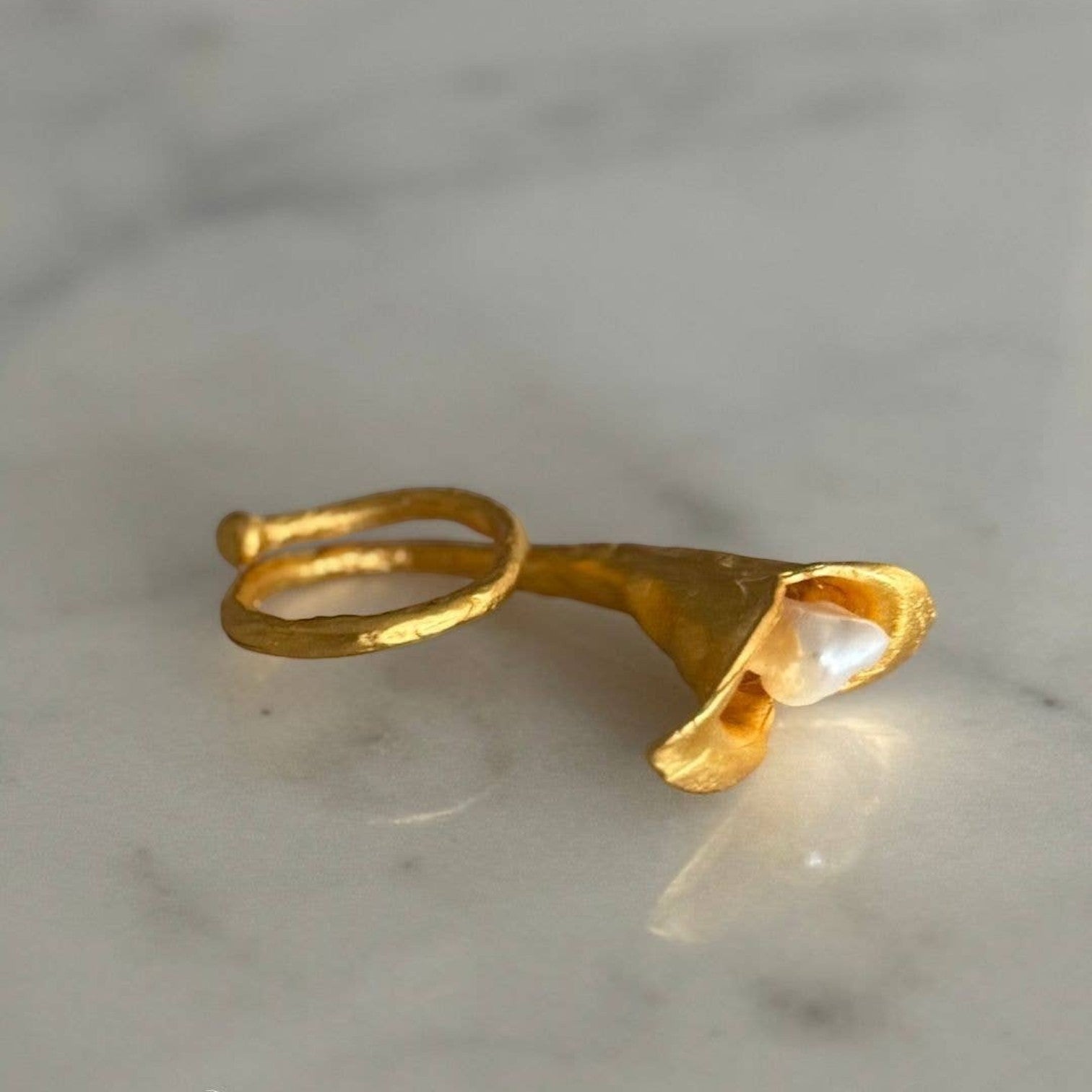 Trebor Style calla lily ring in brushed 24k gold filled metal with a lustrous biwa pearl on an adjustable band.