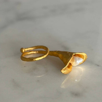 Trebor Style calla lily ring in brushed 24k gold filled metal with a lustrous biwa pearl on an adjustable band.