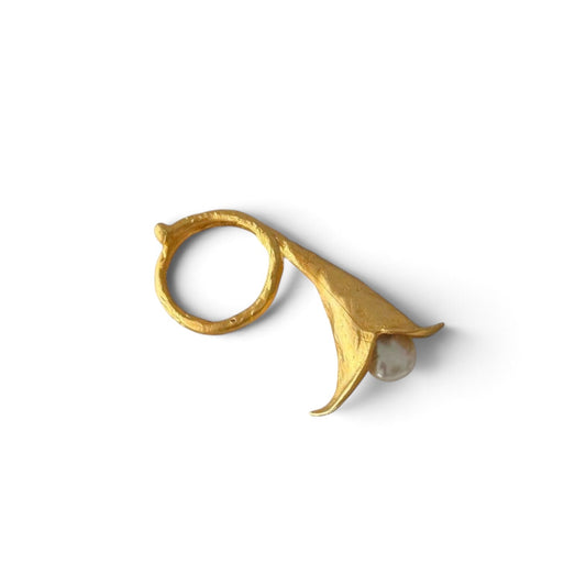 Trebor Style calla lily ring in brushed 24k gold filled finish with a central lustrous biwa pearl on marble surface