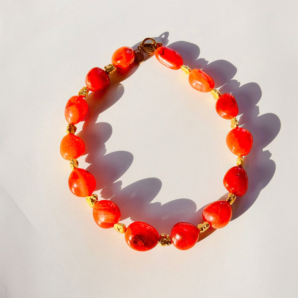 Trebor Style organic carnelian gemstone statement necklace with gold plated brass toggle clasp, 19 inches long.