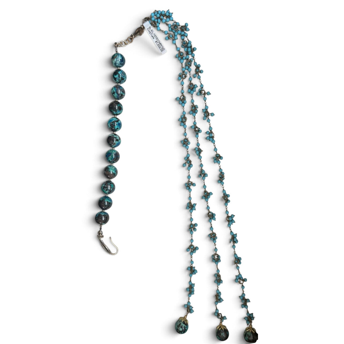 Trebor Style asymmetrical necklace featuring large chrysocolla beads and three strands of turquoise tassel beads.