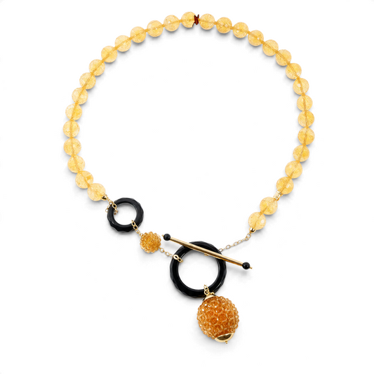 Trebor Style Rajola necklace featuring faceted yellow citrine beads, black onyx rings, and 18k yellow gold toggle clasp.