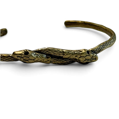 Trebor Style thin double serpent bangle in reclaimed brass with intricate scale detailing and Austrian crystal eyes.