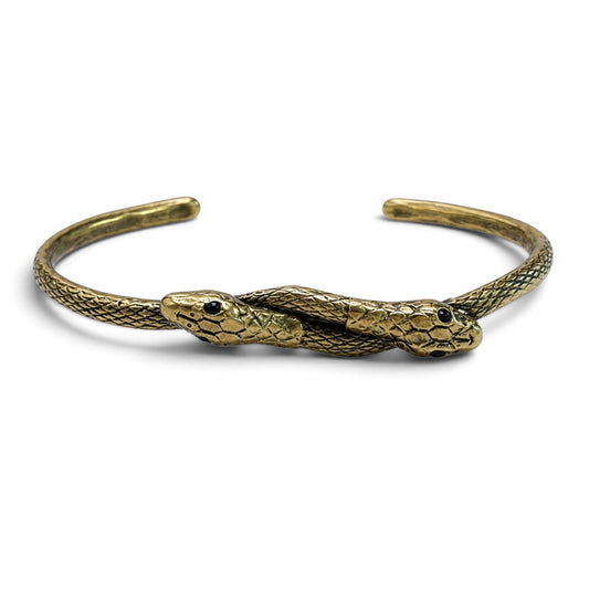 Trebor Style thin double serpent bangle in reclaimed copper and zinc with Austrian crystal eyes on a white background
