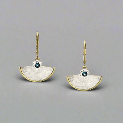 Trebor Style fan-shaped sterling silver earrings with 14kt gold-filled borders and London Blue Topaz gemstones.