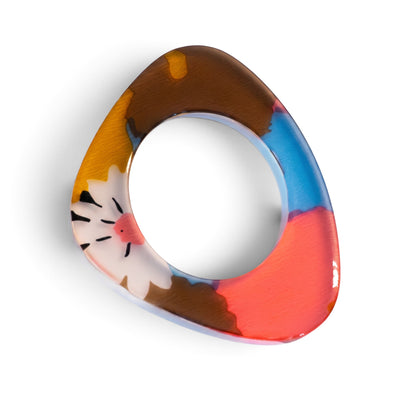 Trebor Style flat acrylic bangle in a triangular shape with hand-painted abstract floral motifs in coral and blue.
