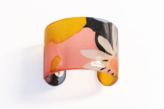 Trebor Style wide cuff bracelet featuring a vibrant floral silk print encased in polished clear acrylic.