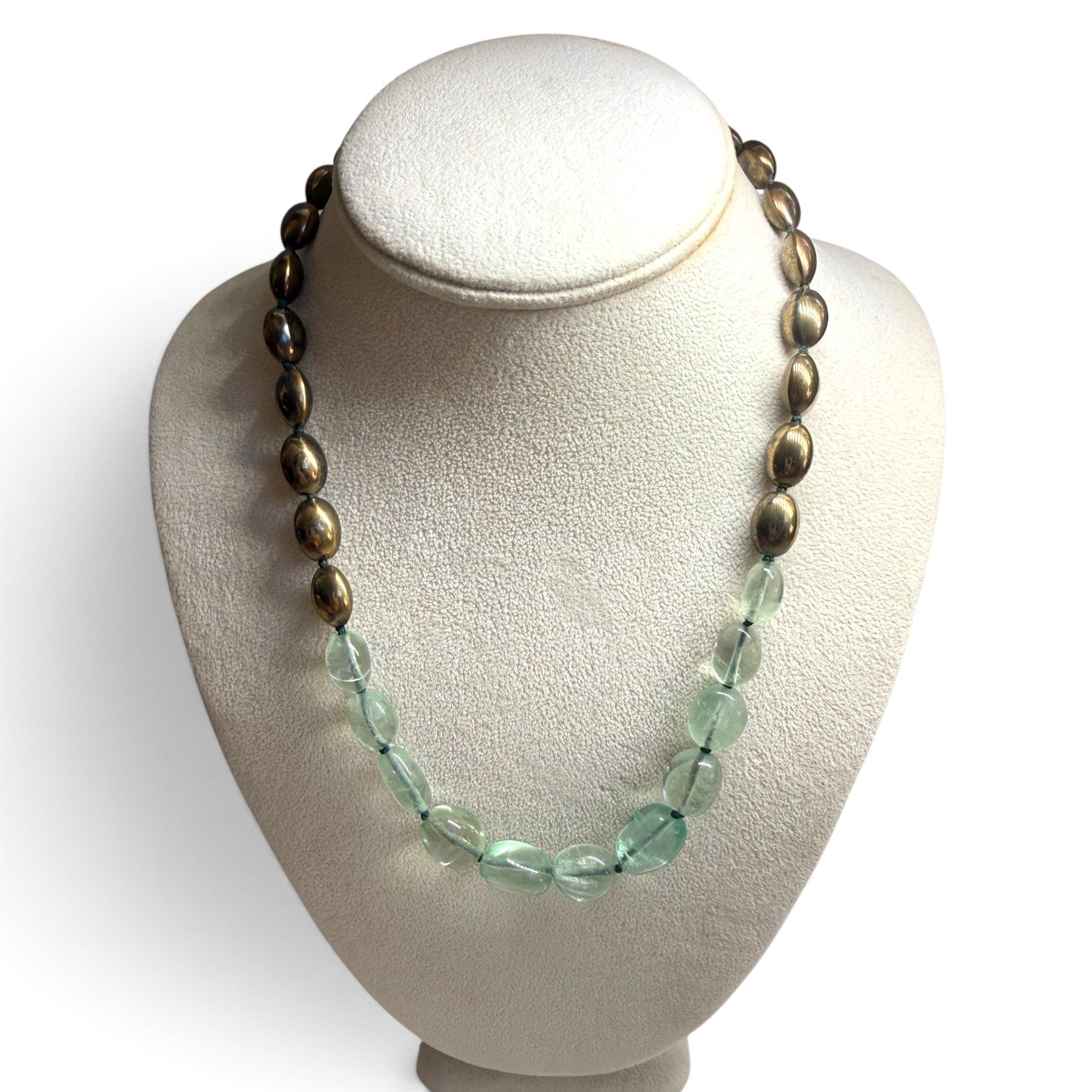 Trebor Style handcrafted statement necklace featuring pale green fluorite beads and metallic bronze oval accents.