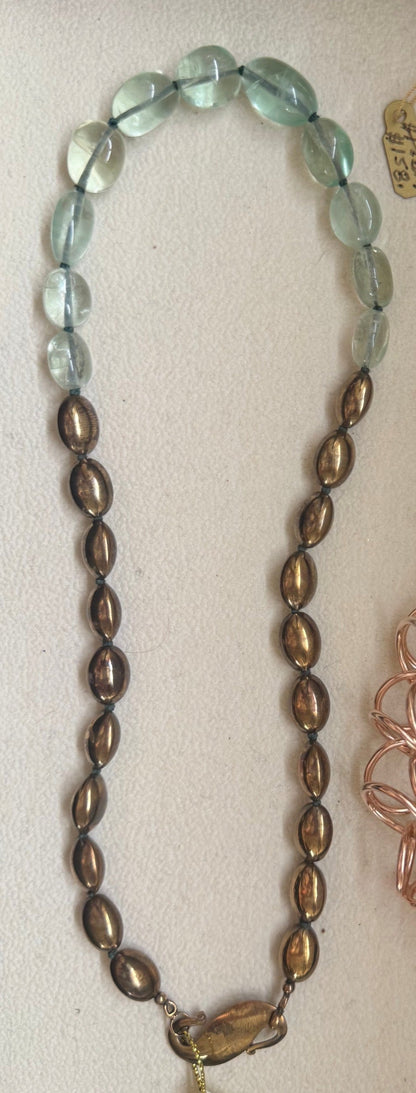 Trebor Style handcrafted statement necklace featuring pale green fluorite beads and metallic bronze oval accents.