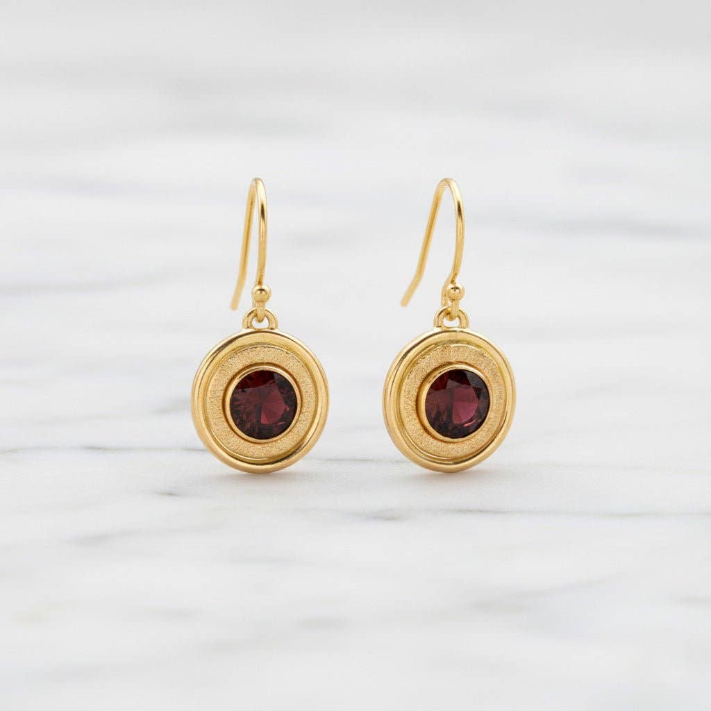 Trebor Style garnet earrings featuring 6mm crimson stones in 14K gold-filled double halo frames with textured detail.