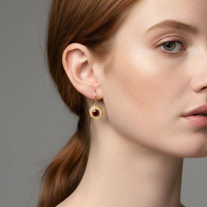 Trebor Style garnet earrings featuring 6mm crimson stones in 14K gold-filled double halo frames on a model