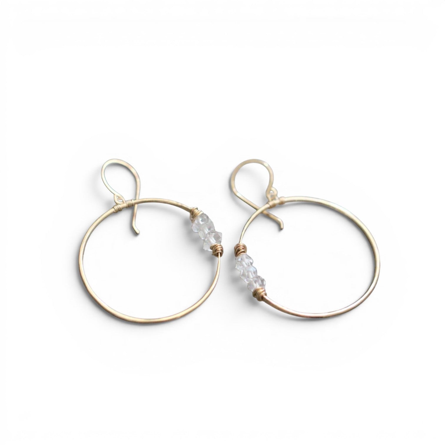 Trebor Style Gemini hoop earrings in 14k gold fill featuring hand-hammered wire and natural Herkimer diamond accents.