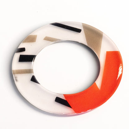 Trebor Style hand-painted flat acrylic bangle featuring a bold red, black, and white geometric graphic design.