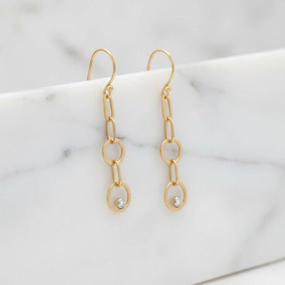 Trebor Style gold-filled double circle drop earrings with lab-grown diamonds on French hooks against marble background