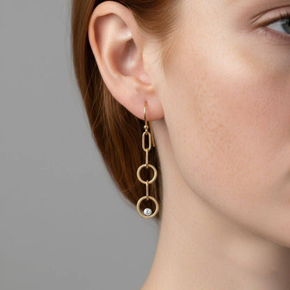 Trebor Style double circle drop earrings in 14K gold-filled with lab-grown diamonds worn on a model