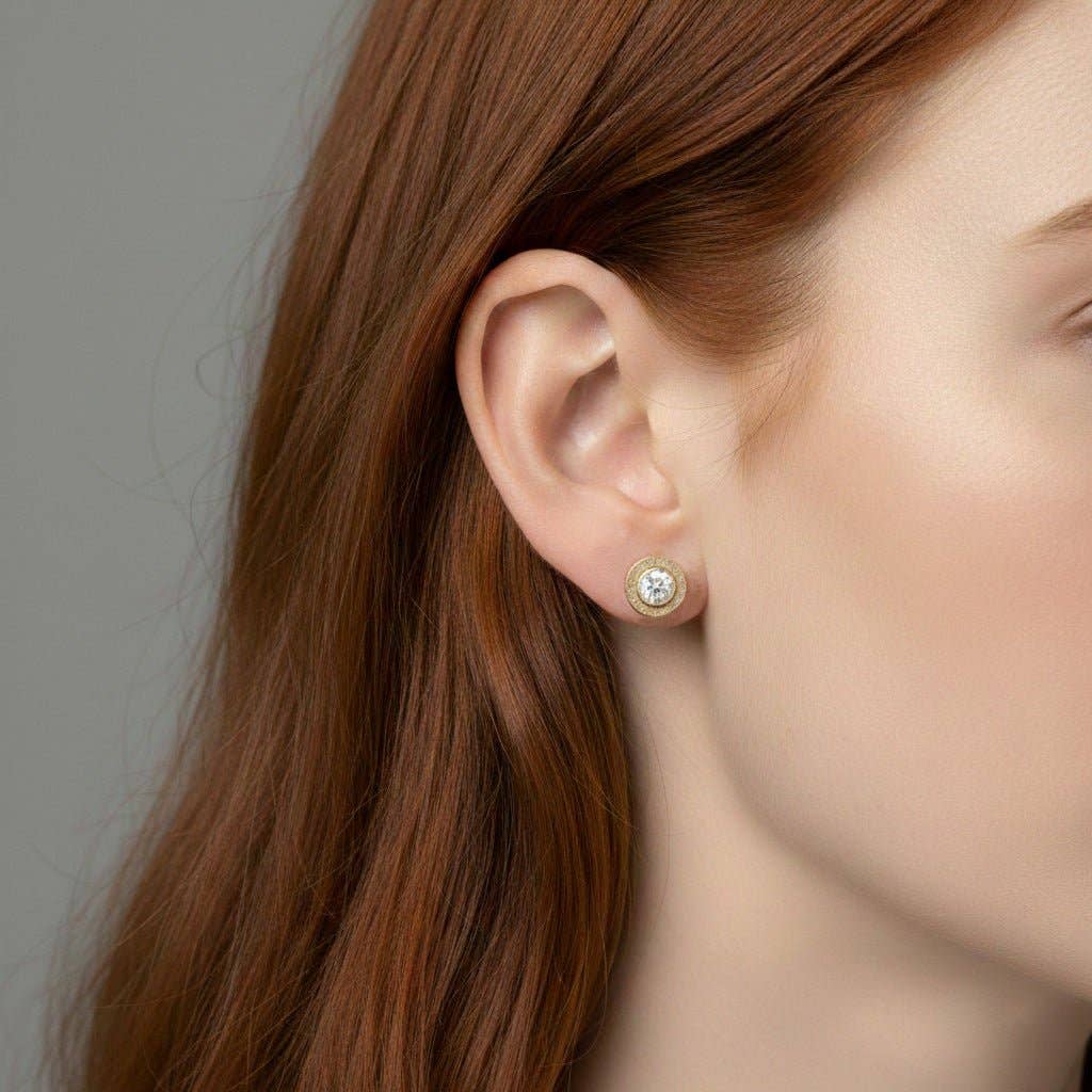 Trebor Style diamond stud earrings featuring a 4mm lab-grown diamond in a 14kt gold-filled bezel worn on an earlobe.