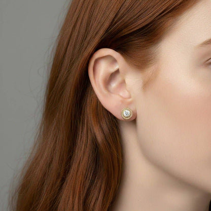 Trebor Style diamond stud earrings featuring a 4mm lab-grown diamond in a 14kt gold-filled bezel worn on an earlobe.