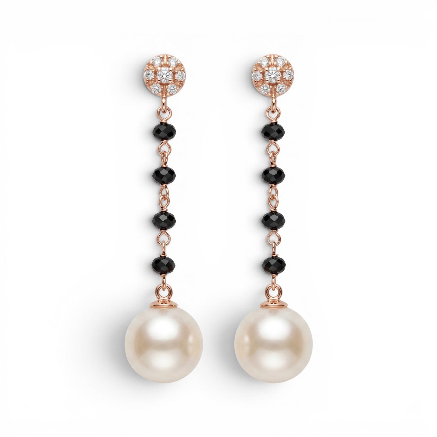 Trebor Style 18k gold drop earrings featuring diamond studs, black onyx beads, and large white cultured pearls.