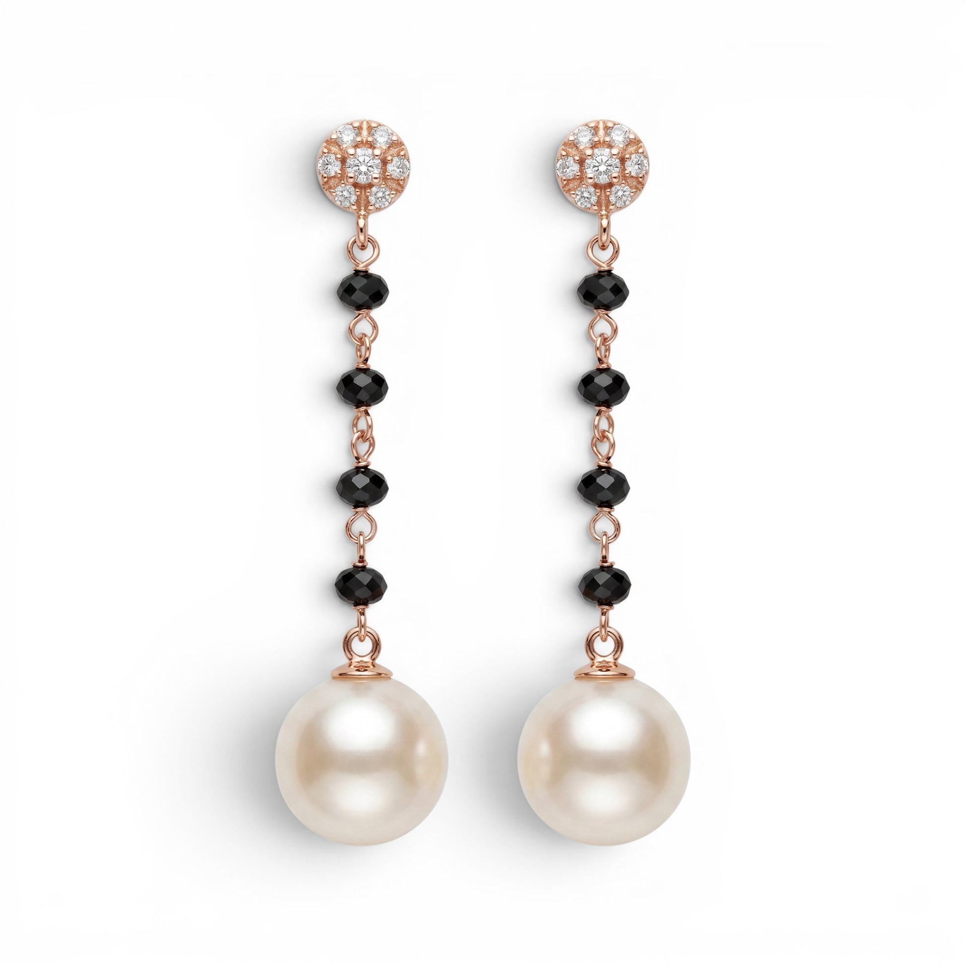 Trebor Style 18k gold drop earrings featuring diamond studs, black onyx beads, and large white cultured pearls.