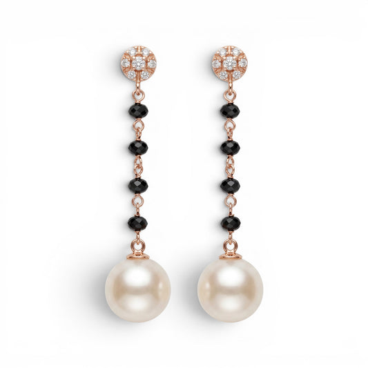 Trebor Style 18k gold drop earrings featuring diamond studs, black onyx beads, and large white cultured pearls.