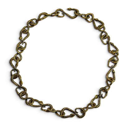 Trebor Style gold patina snake chain necklace featuring 22 interlocking snake links in a circular arrangement.
