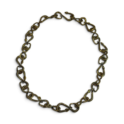 Trebor Style gold patina snake chain necklace featuring 22 interlocking snake-shaped links for versatile styling.