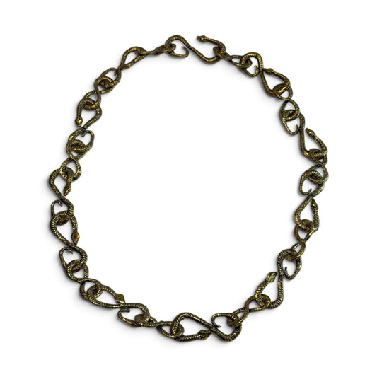 Trebor Style gold patina snake chain necklace featuring 22 interlocking snake-shaped links for versatile styling.