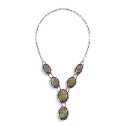 Trebor Style sterling silver necklace featuring six graduating oval green turquoise medallions in vintage settings.