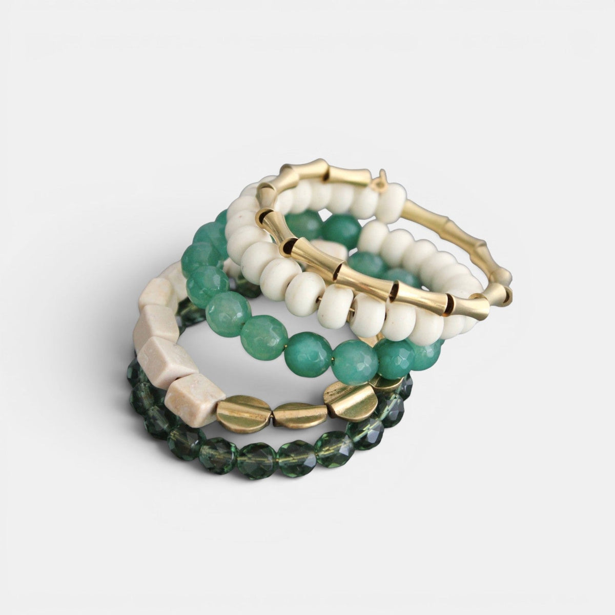 Trebor Style handcrafted wrap bracelet featuring green glass, white magnesite beads, and gold-tone brass accents.