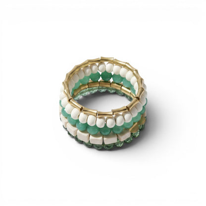 Trebor Style handcrafted wrap bracelet featuring green glass, white magnesite beads, and brass accents.