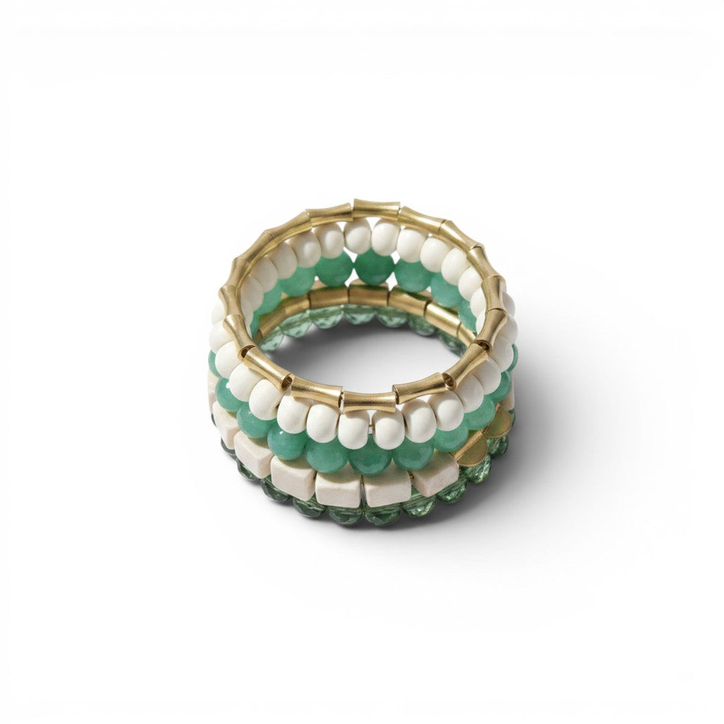 Trebor Style handcrafted wrap bracelet featuring green glass, white magnesite beads, and brass accents.