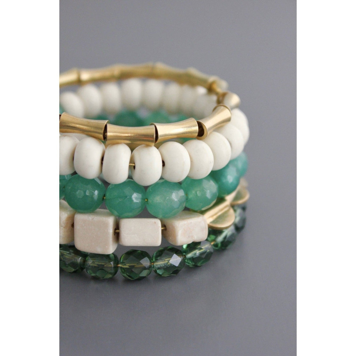 Trebor Style handcrafted wrap bracelet featuring green and white glass, magnesite beads, and brass accents.