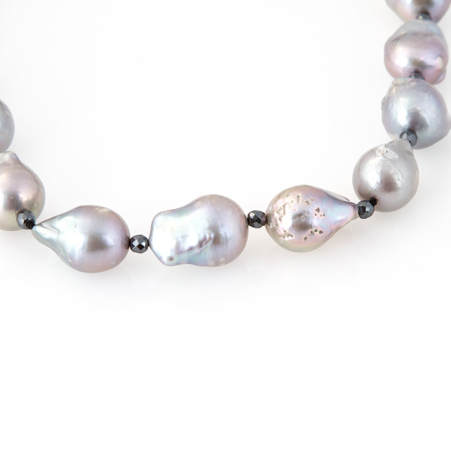 Trebor Style long necklace featuring large grey baroque pearls and sparkling pyrite bead accents on a cord strand.
