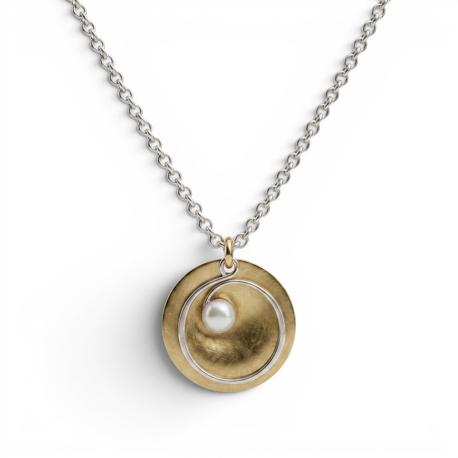 Trebor Style hammered brass disc pendant necklace with a silver spiral wire and white pearl on a silver link chain.