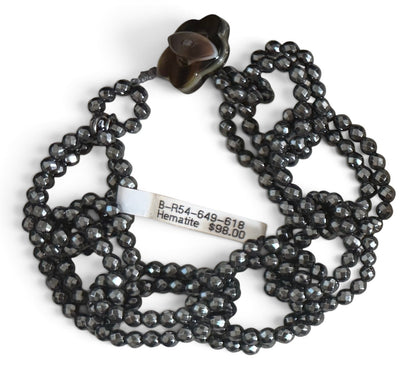 Trebor Style Rajola faceted dark grey hematite bead infinity link bracelet with a mother of pearl toggle closure